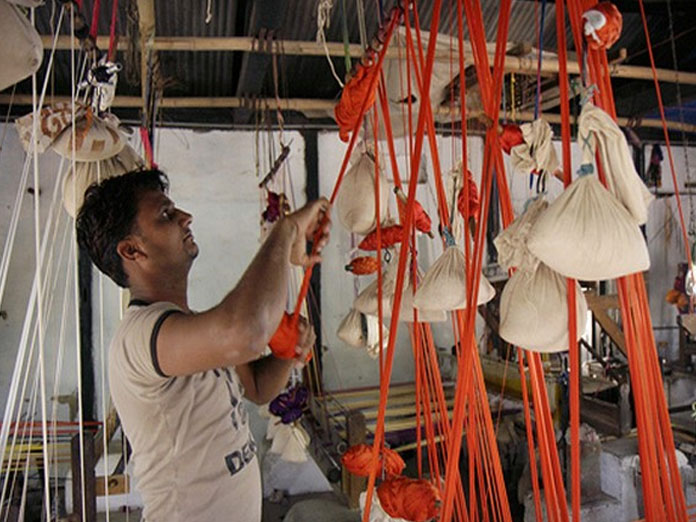 Low renumeration, cheap replicas threat to Odishas Sambalpuri weavers