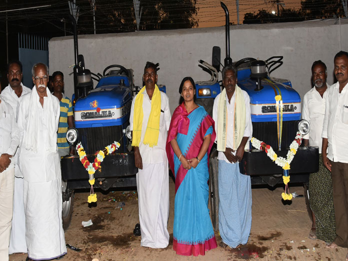 Minister distributes tractors to farmers