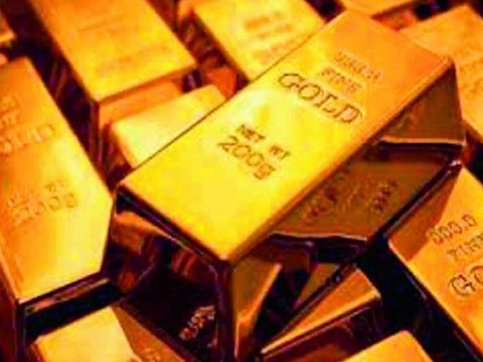 Gold falters on weak global cues, tepid demand