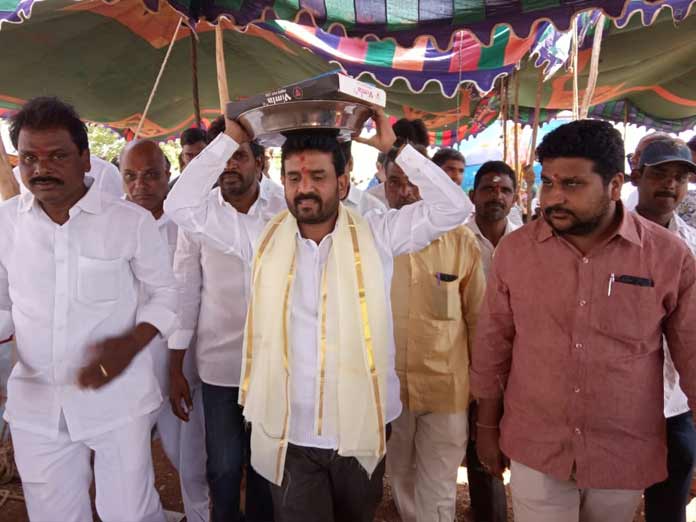 MLA Anand offers silk robes to deity