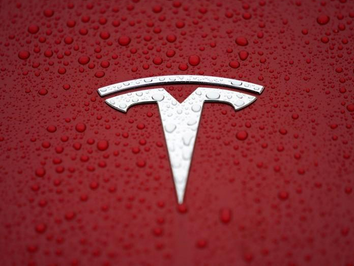 Tesla debuts $35,000 Model 3, sees loss in first quarter