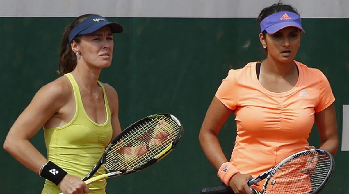 Sania-Hingis stroll into third round of French Open
