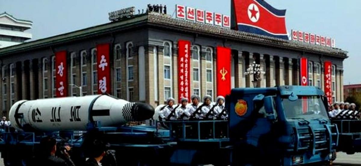 North Korea displays apparently new missiles as U.S. carrier group approaches
