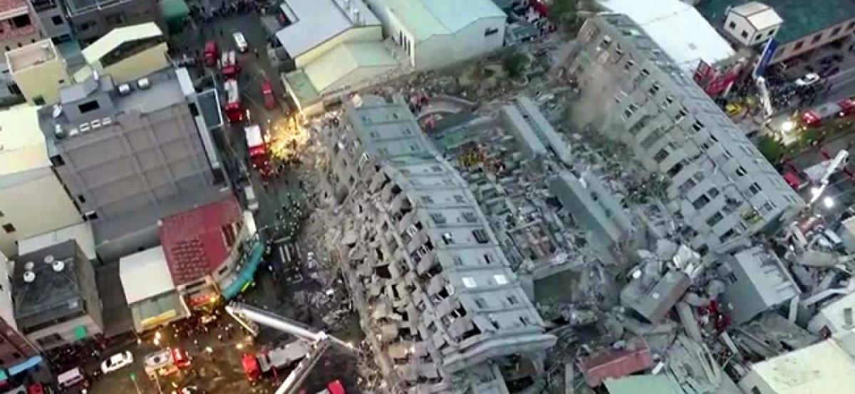 Taiwan quake rescuers trying to save 120 people still trapped in the debris of building