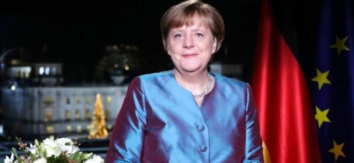 Angela Merkel urges Germany to face down terror with cohesion, compassion
