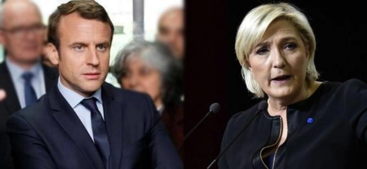 French presidential foes Macron, Le Pen take spin battle to tumble-drier factory