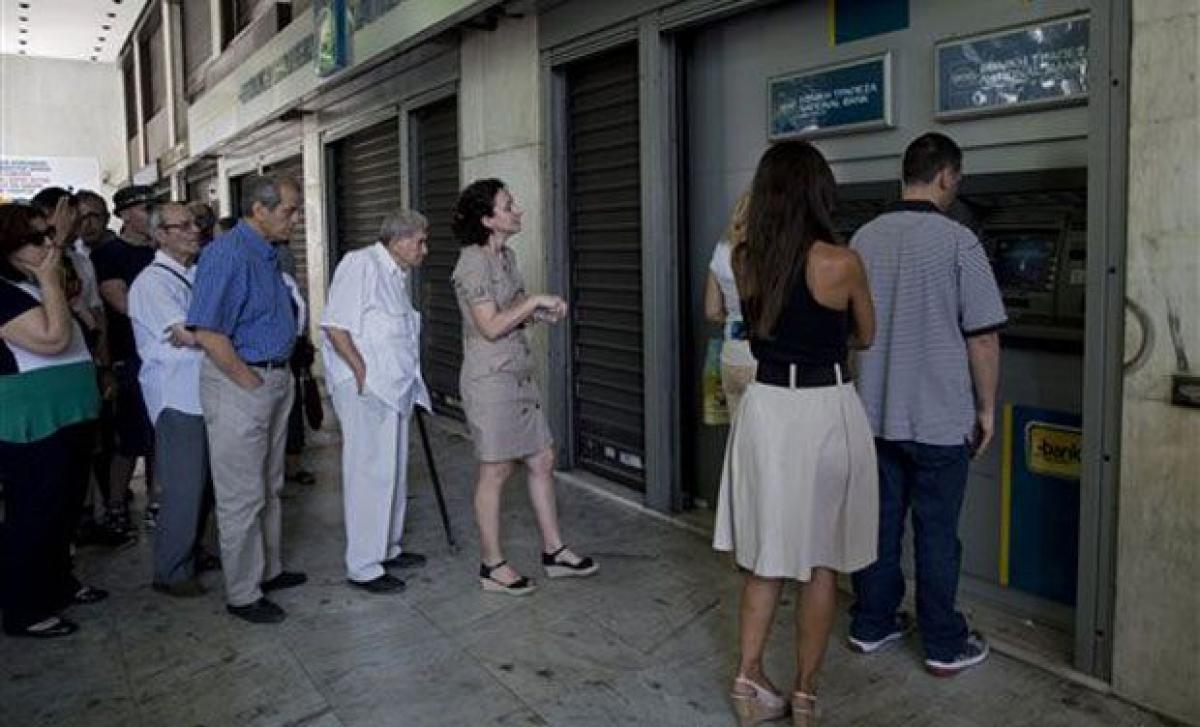 Crunch time in Greece as bailout due to expire, IMF loan due