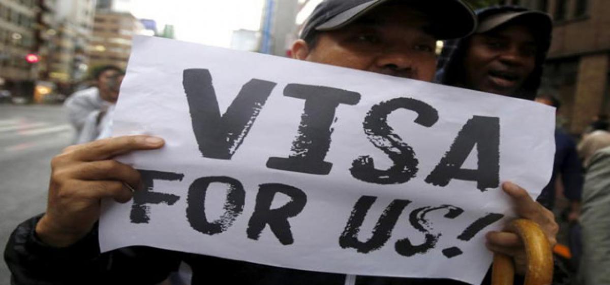 US suspends premium H-1B visas