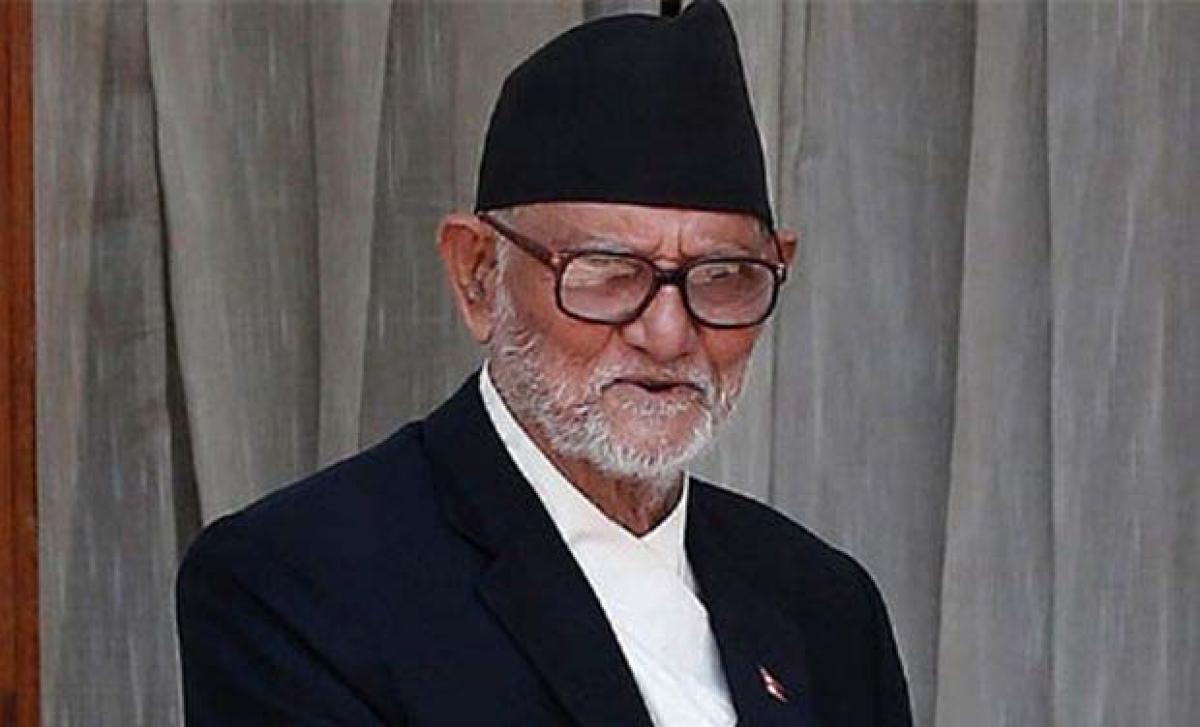 Nepal PM Koirala scraps UN trip to tackle protests over constitution