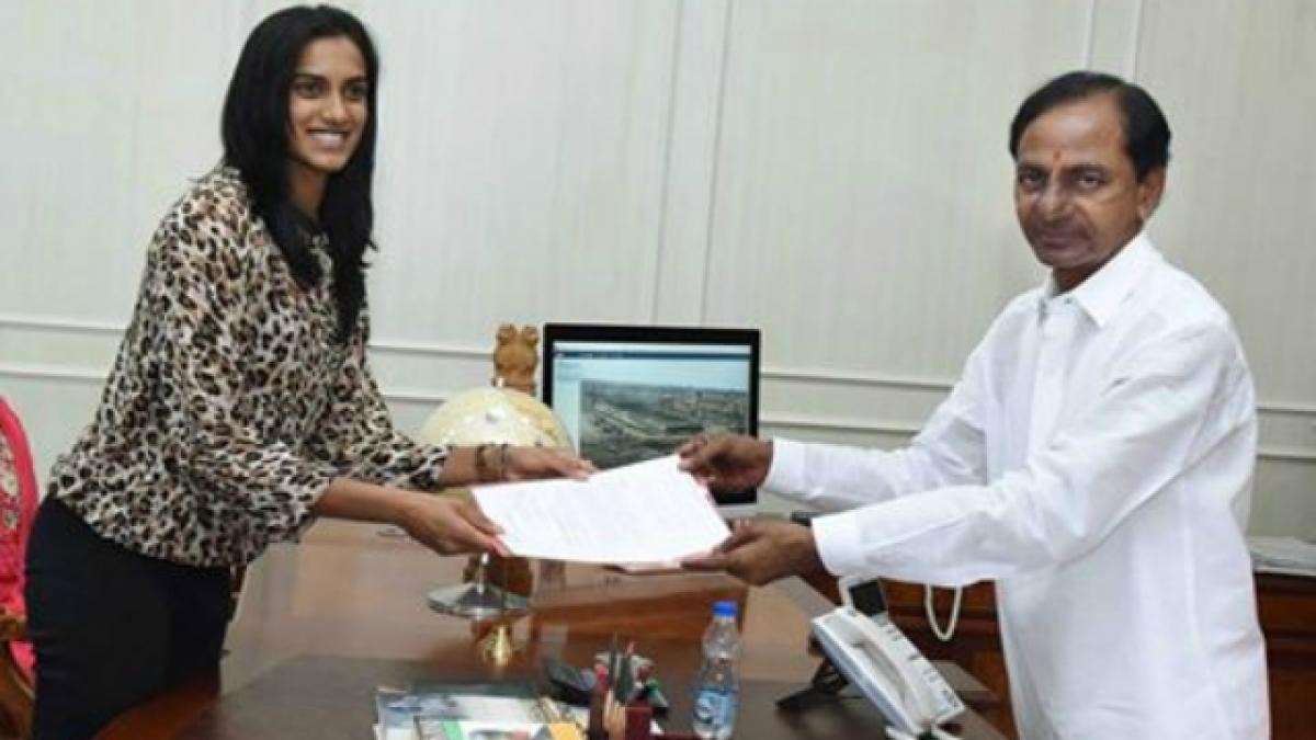 KCR hands plot allotment order to PV Sindhu