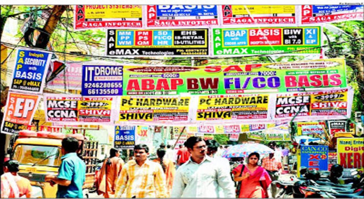 GHMC removes banners at Maithrivanam