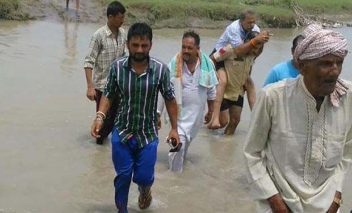 Security officer carries BJP MLA on back in J-K