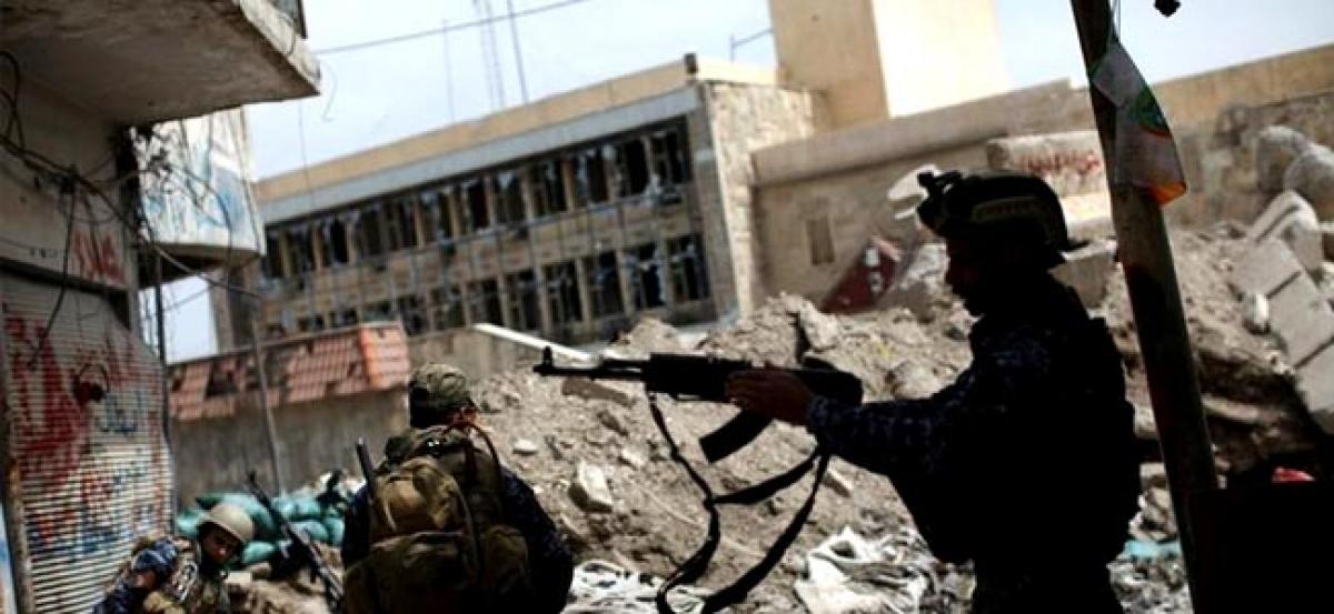 Iraqi forces fight door-to-door in Mosul as battles enters seventh month