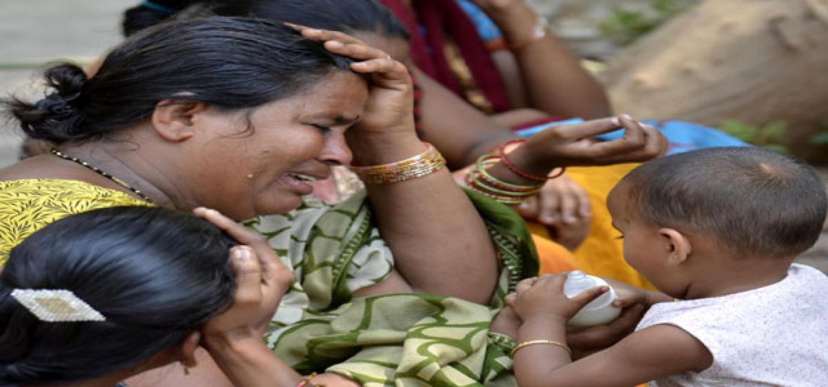 2 workers choke to death in manhole