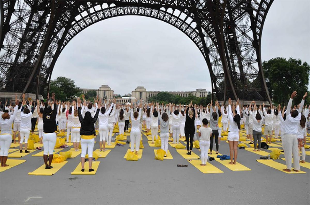 Eiffel Tower and Bateaux-Mouche boat in France pays fitting tribute to Yoga