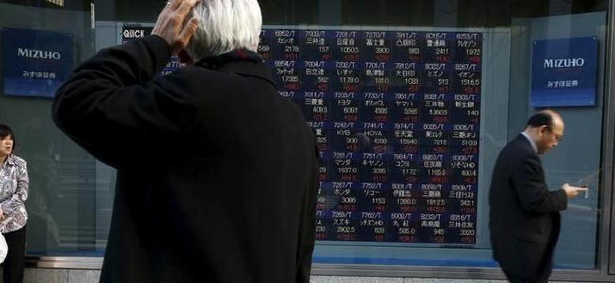 Asian stocks tepid, dollar near 14-year peak on Fed rally