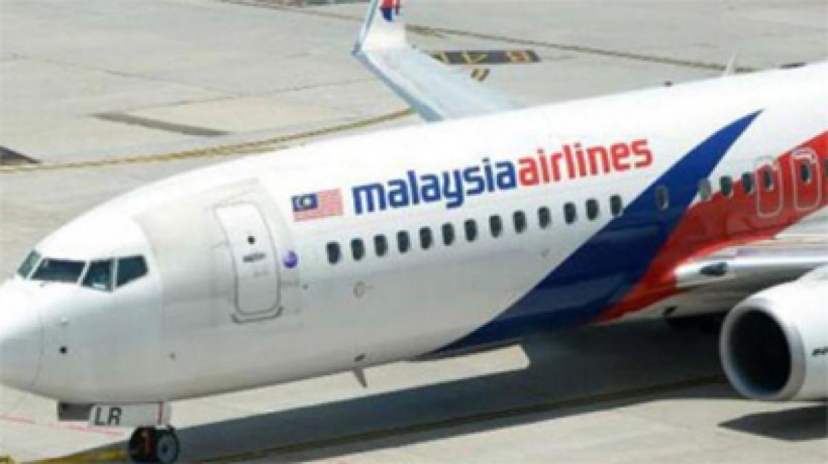 Families of 12 passengers on flight MH370 file lawsuits