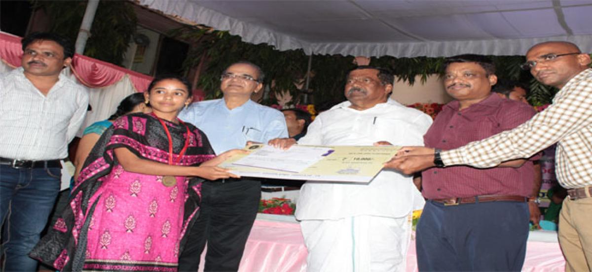 Minister gives away merit certificates to students