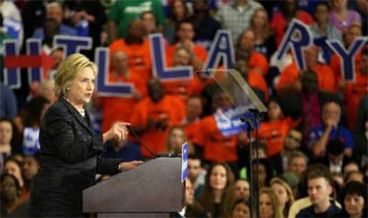 Unfazed by Michigan loss, Hillary continues marathon debate