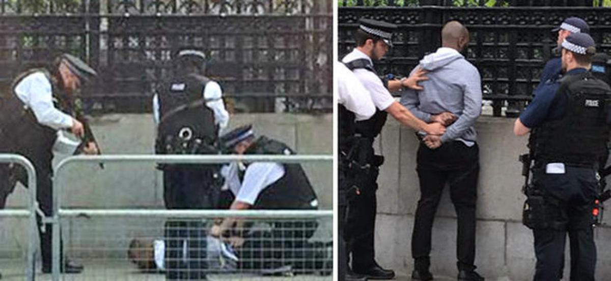 UK police take man from outside parliament away in van