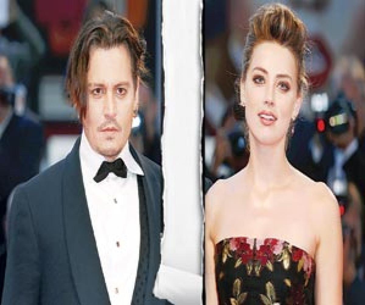 Johnny Depp Amber Heard settle divorce