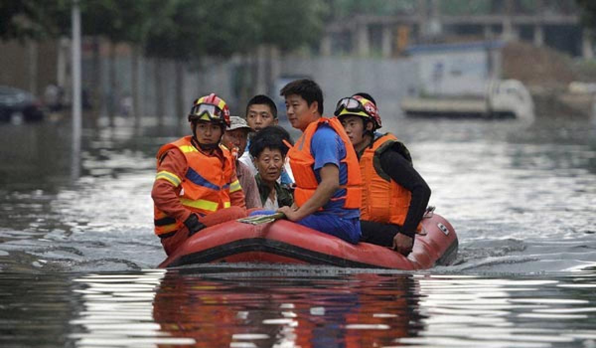 225 killed in China rains:protests break out