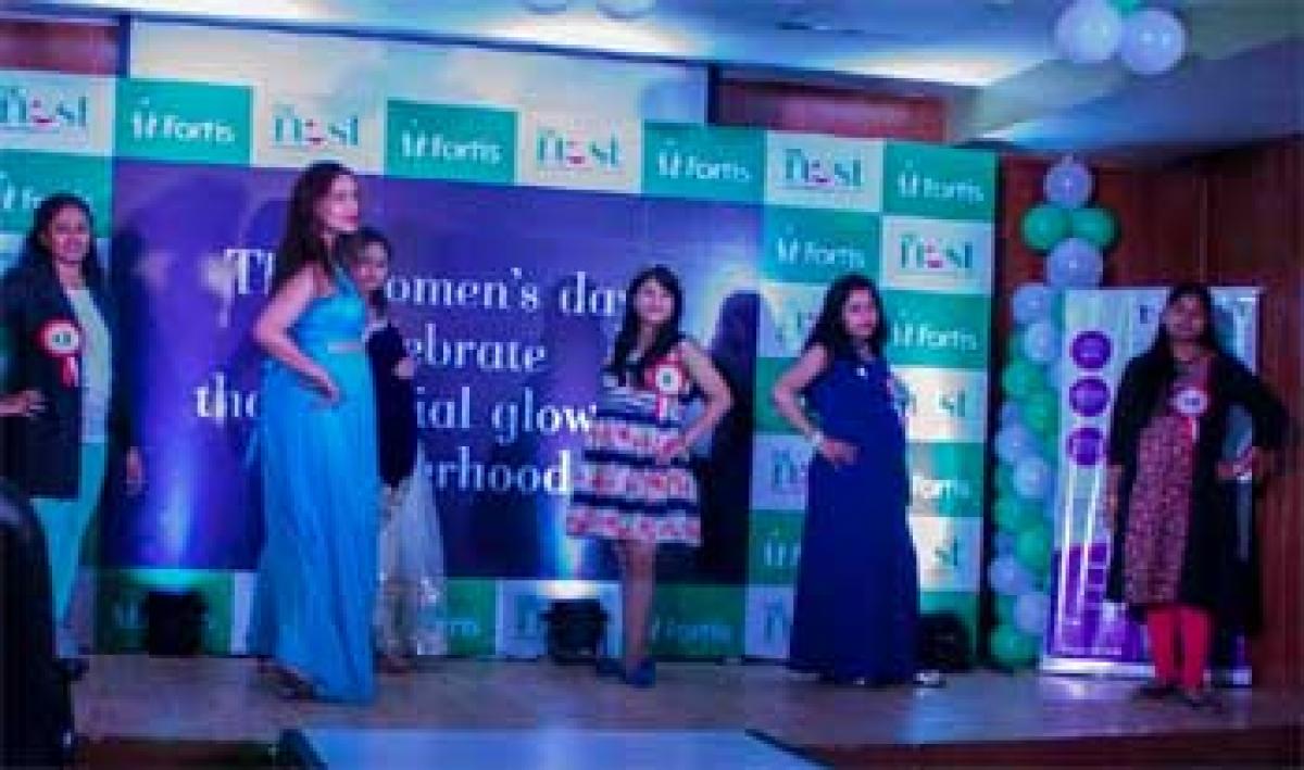 Expectant mothers walk the ramp to celebrate International Women’s day