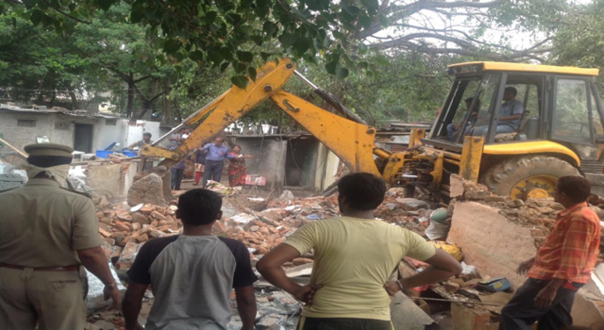 Illegal huts razed in Gandhi Colony, Picket