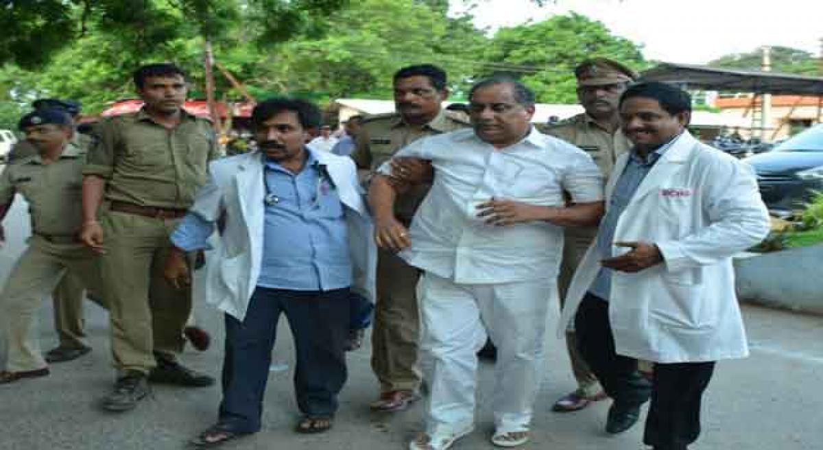 Cops smash doors open to arrest Mudragada