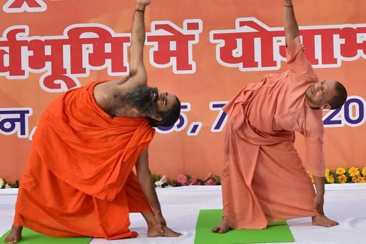 Uttar Pradesh Chief Minister Yogi Adityanath, Governor Ram Naik Practice Yoga With Baba Ramdev