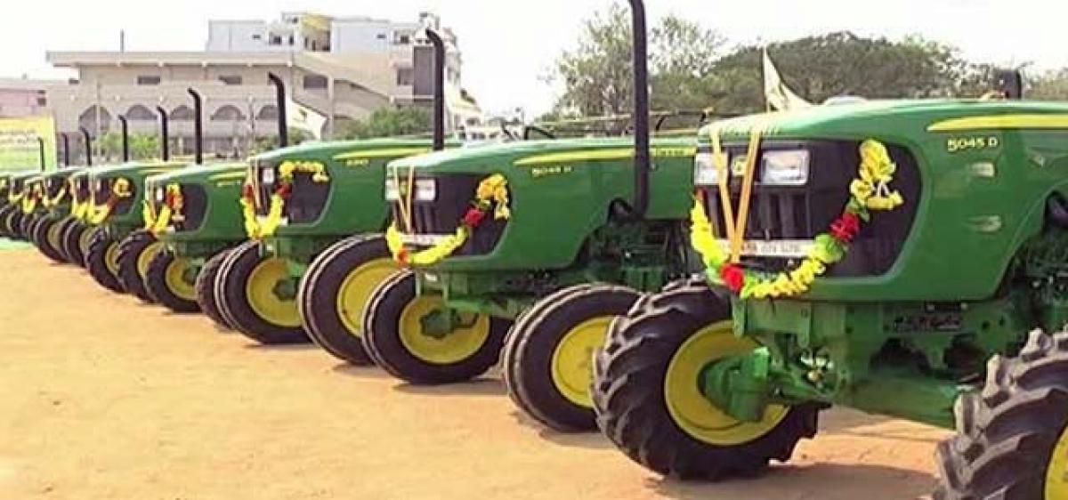 Telangana Govt whip Gampa distributes tractors in Kamareddy