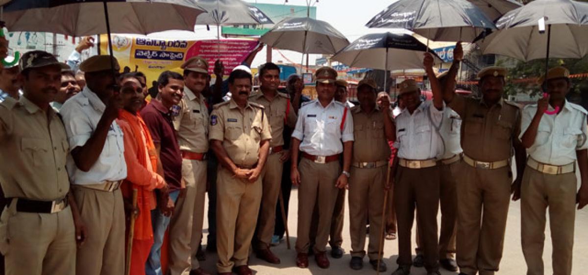 Umbrellas distributed to traffic police in Mancherial