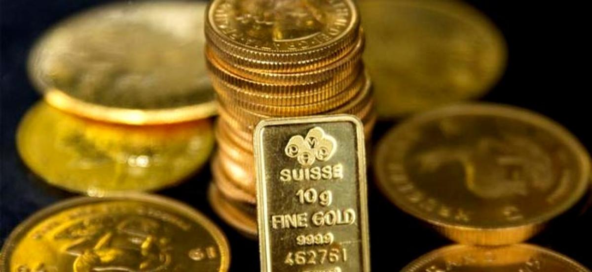 Gold loses shine as U.S. Fed feelings lift dollar