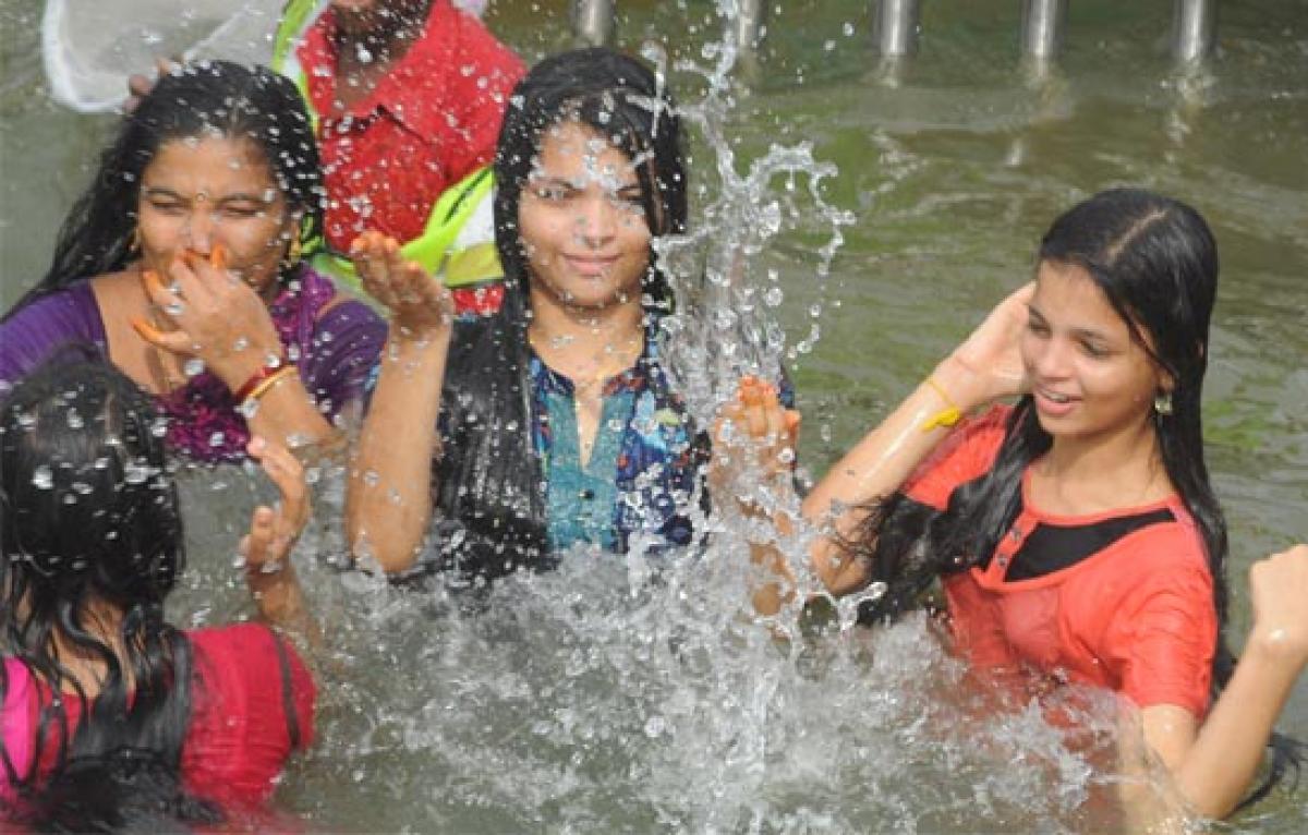 Youth enjoy at widened spacious ghats