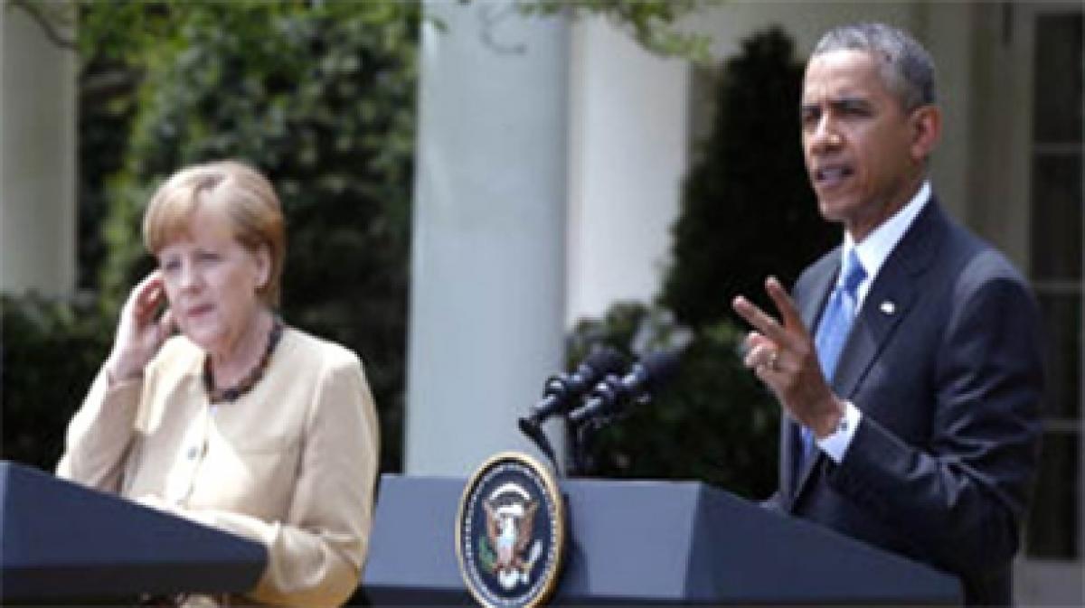 Merkel Obama vow to protect millions hit by war