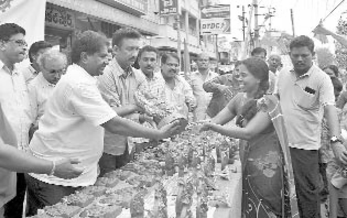 NGOs distribute clay Ganesha idols