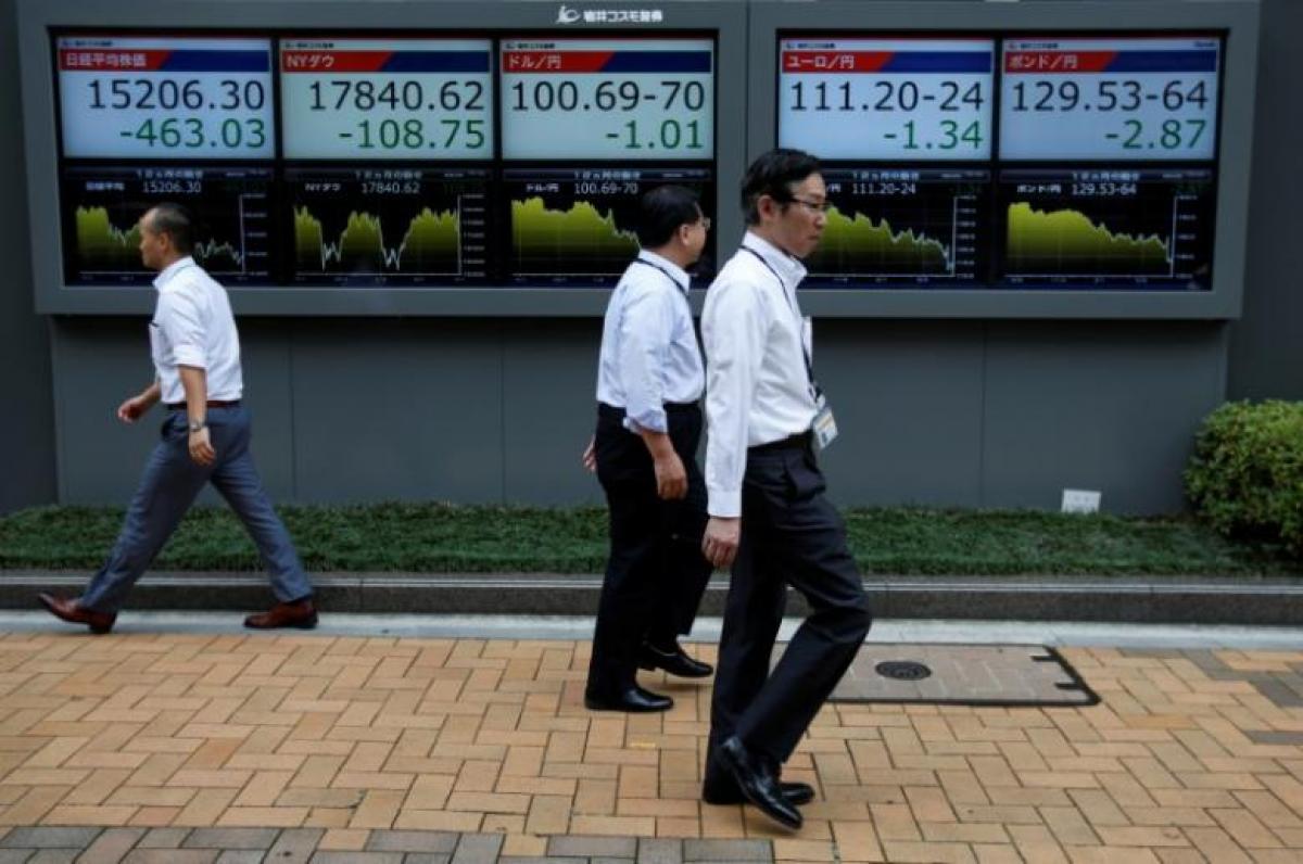 Asia shares off to cautious start as Fed rate hike looms