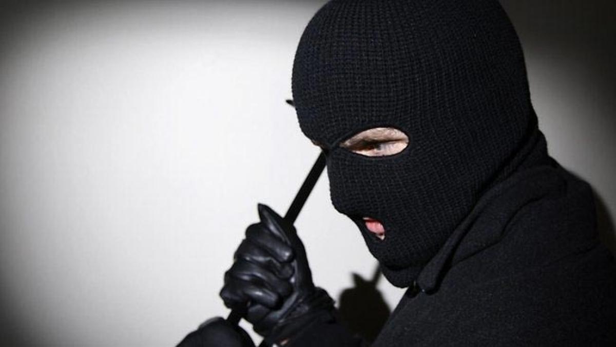 Burglars assault woman, neighbour