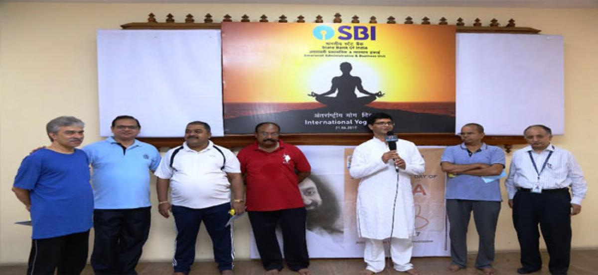 State Bank of India staff celebrates International Yoga Day