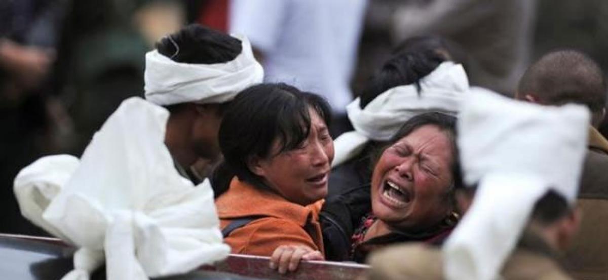 Villagers begin to mourn dead after deadly China landslide