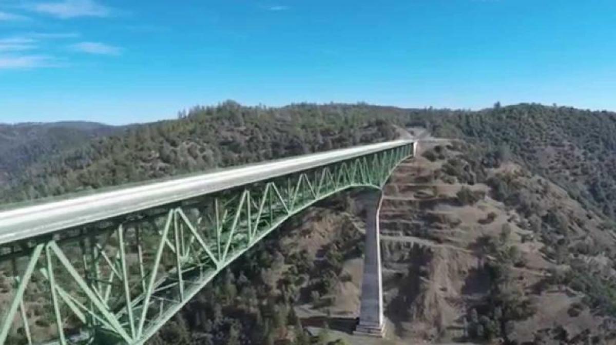 Woman falls off tallest California bridge while taking selfie, survives
