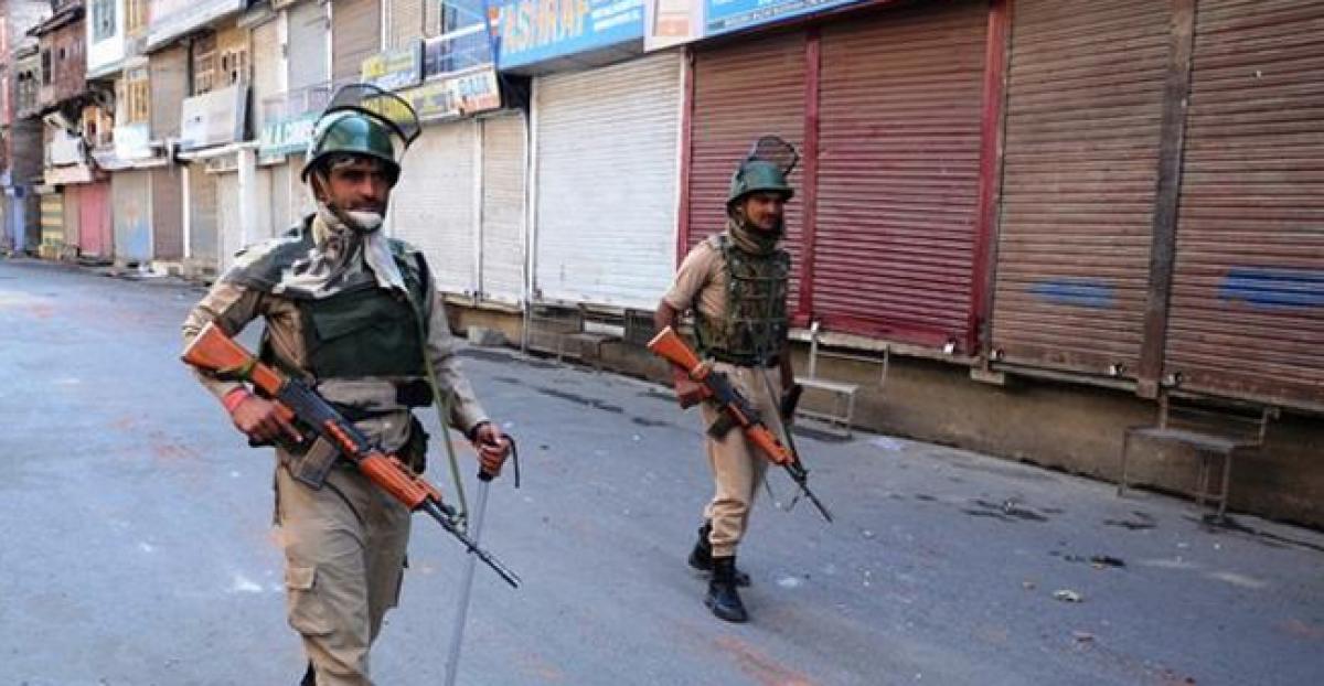 Quiet on Srinagar roads dotted by security men a la graveyard