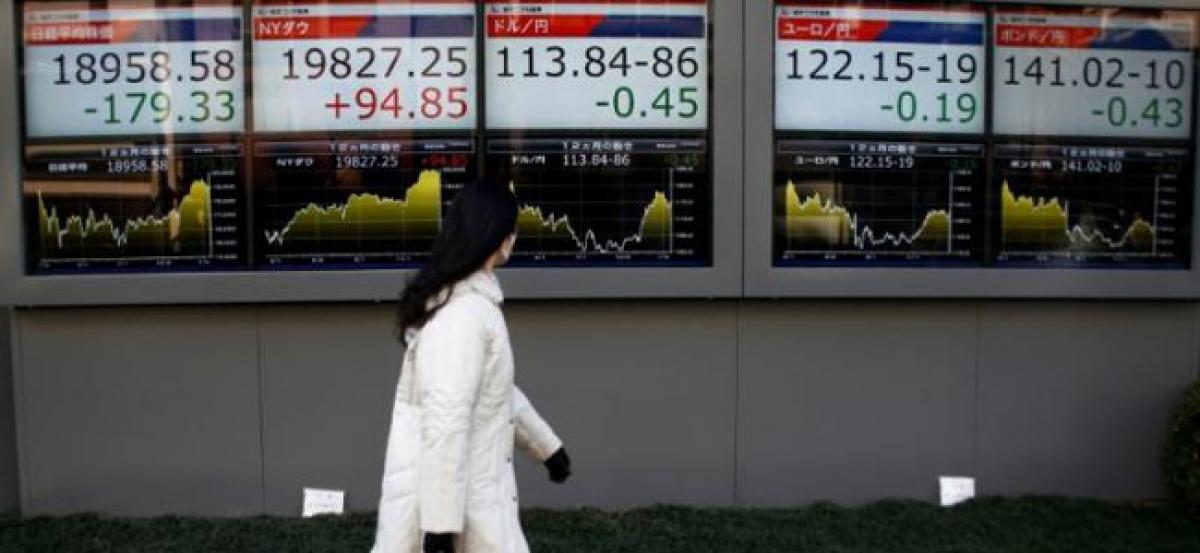 World stocks slip on China downgrade, ahead of Fed minutes