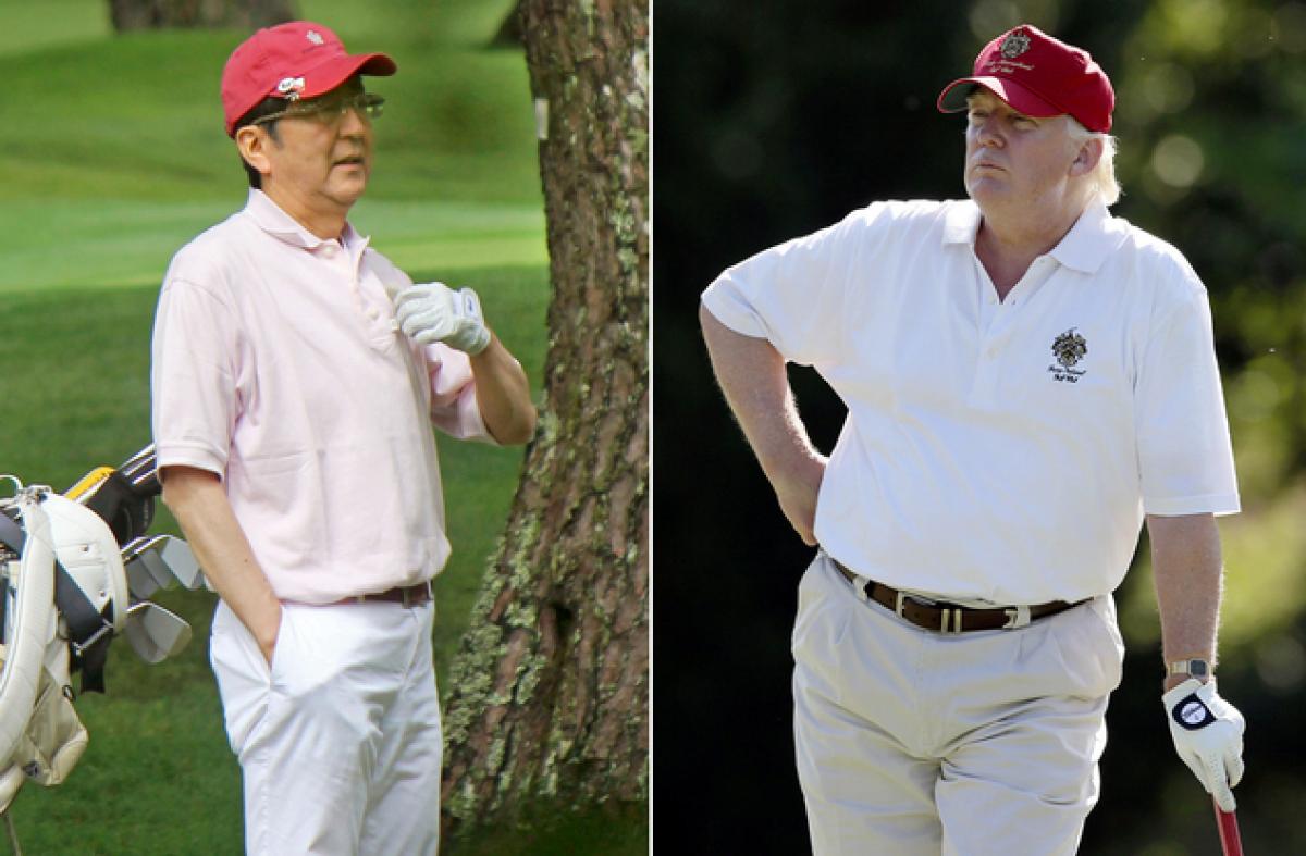 With golf and gifts, Japans Abe cuts own path with Trump