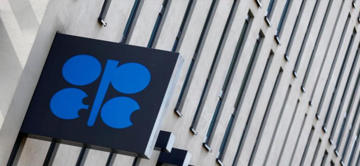 OPEC sees oil market rebalancing at slower pace, says output rises