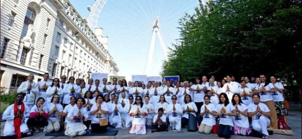 International Yoga Day: Enthusiasts celebrate at London Eye, Trafalgar Square