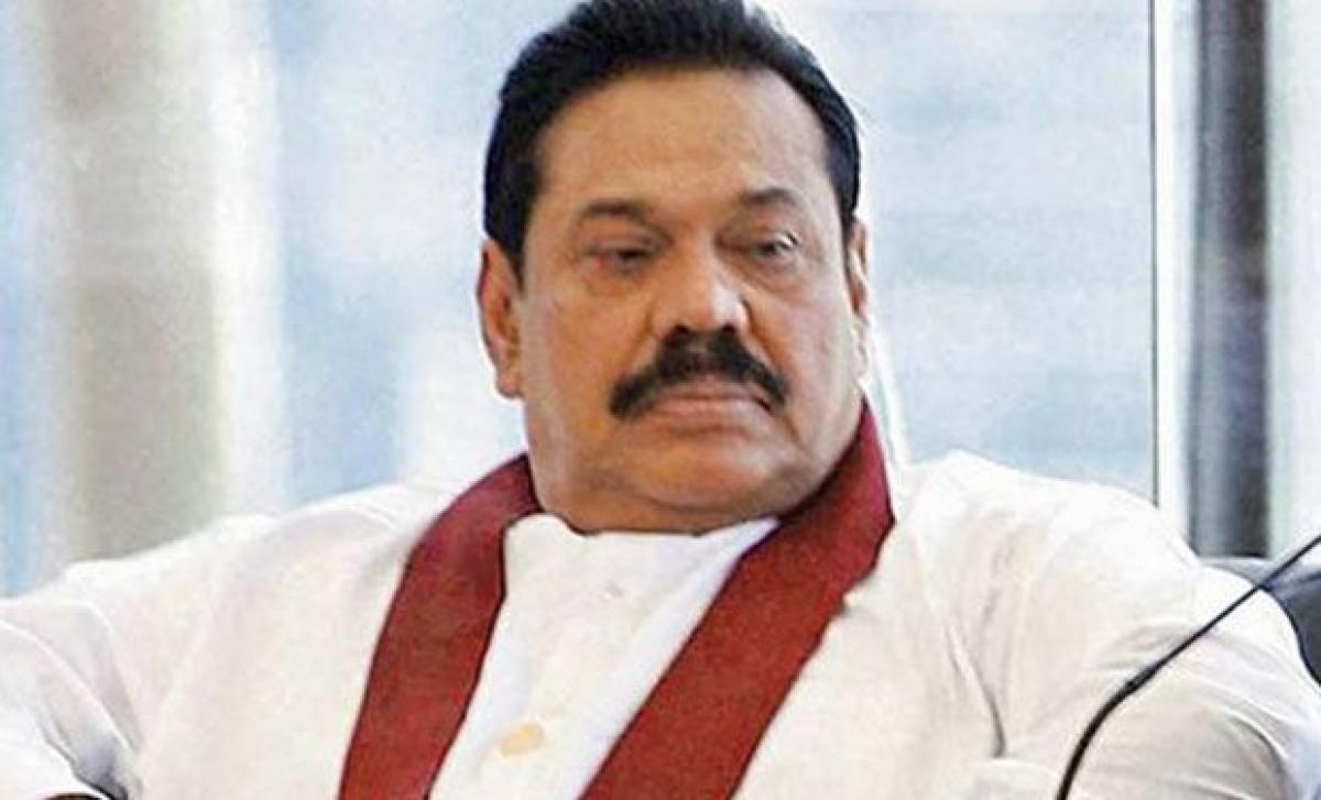 Former Sri Lanka President Mahinda Rajapaksa defends son over murder charges