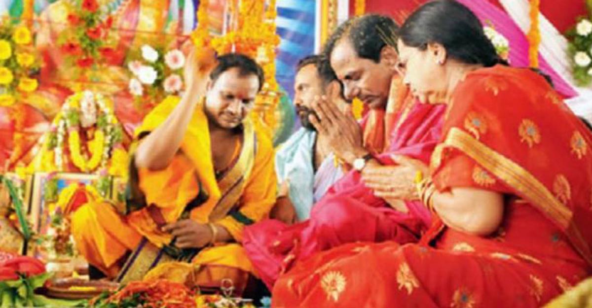 KCR, family members perform puja at farmhouse