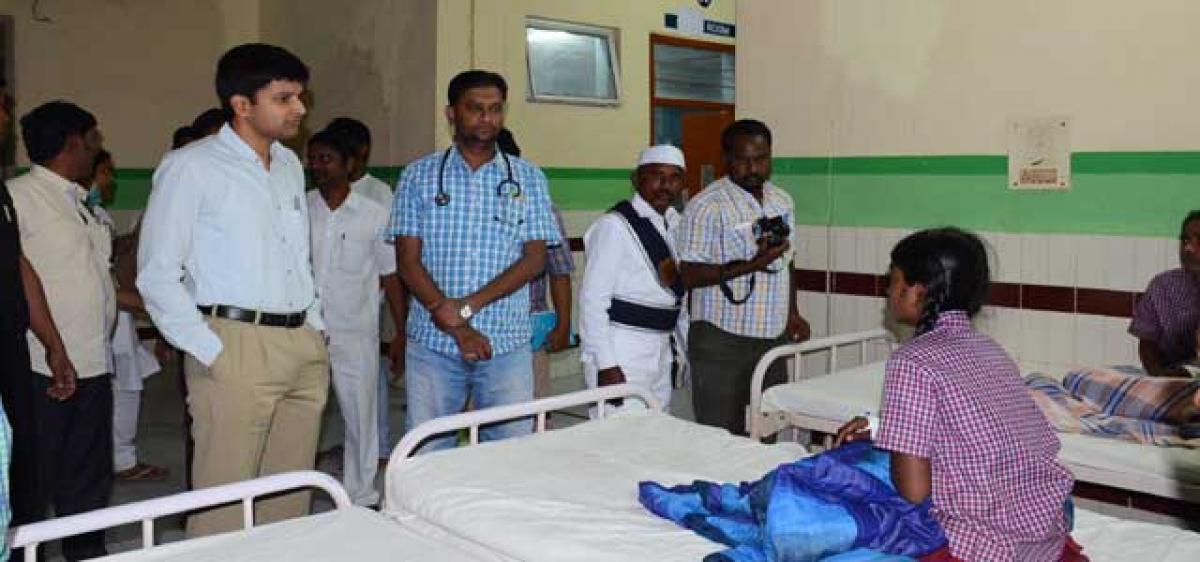 Sircilla Collector visits ailing students at hospital