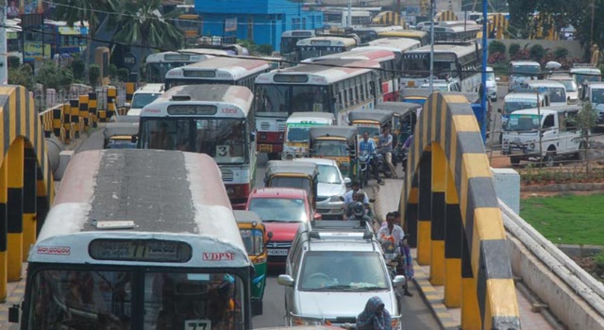 Traffic jam at low bridge in city